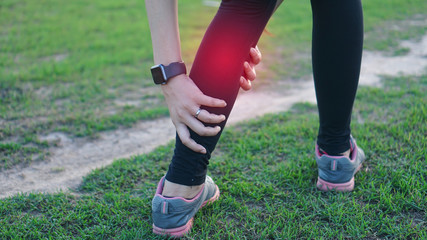 Fototapeta premium Calf leg injury accident in sport exercise running jogging.sprain or cramp Overtrained injured person when training exercising or running outdoors.