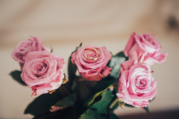 wedding rings on roses 