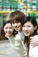 Man posing with two women