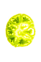 cut green tomato on a white background