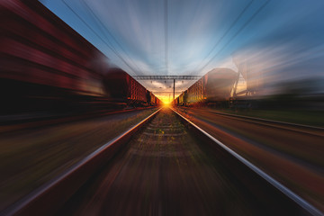 freight, passenger train moves with speed by rail