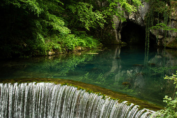 Naklejka premium Monument of nature, spring of river Krupaja or Krupajsko vrelo with underwater cave. Beautiful natural oasis and tourist attraction in Easte