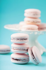 Pink french cookies macaroons on blue background