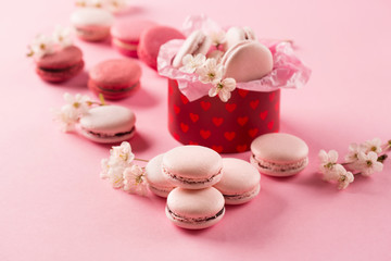 Pink macaroons in red gift box