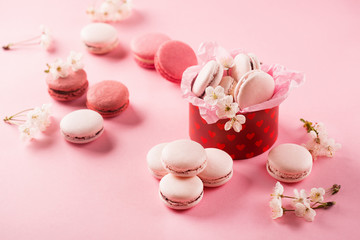 Pink macaroons in red gift box