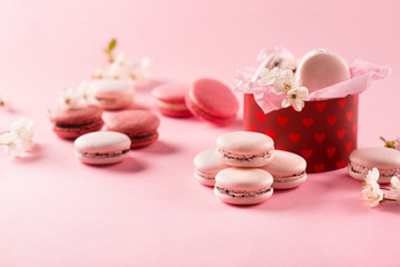 Pink macaroons in red gift box