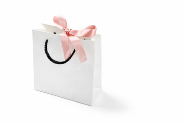 Mock-up of blank craft shopping package, mockup of white paper shopping bag with handles and pink...