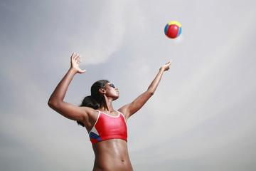 Woman playing beach volleyball