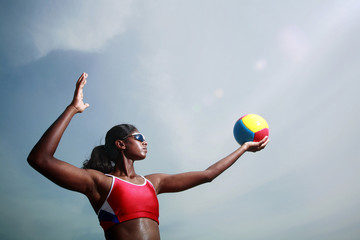 Woman playing beach volleyball