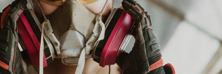 Female carpenter wearing personal protective equipment