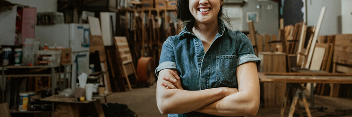 Female carpenter in her wood shop