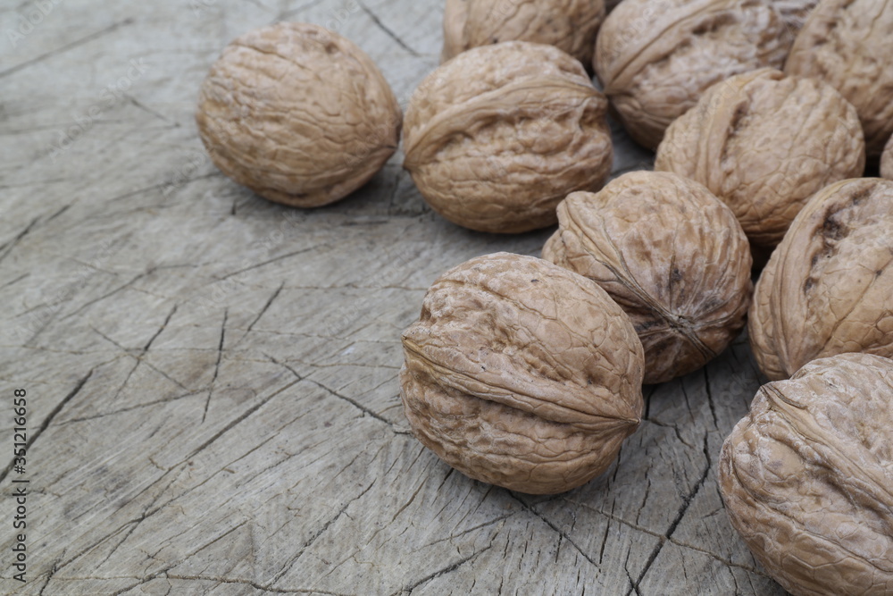 Poster walnuts on wooden table