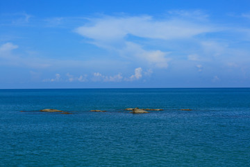Lanscape view of stones in blue sea and blue sky