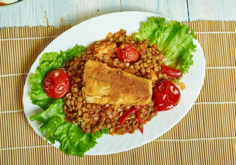 Harissa crumbed fish with lentils