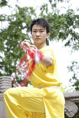 Man practising martial arts with chinese spear