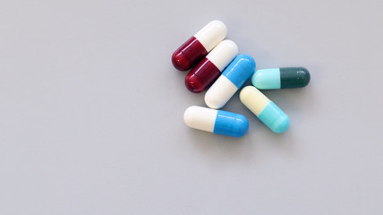 Colorful tablets, pills and capsules medicine using for treatment and cure the disease or sickness. Drug prescription using for medication in medical clinic, pharmacy Pharmaceutical service concept.