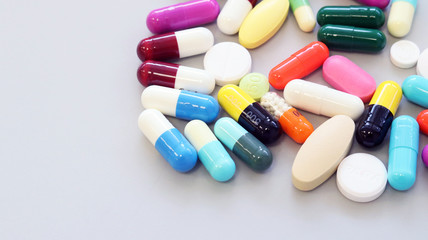 Colorful tablets, pills and capsules medicine using for treatment and cure the disease or sickness. Drug prescription using for medication in medical clinic, pharmacy Pharmaceutical service concept.