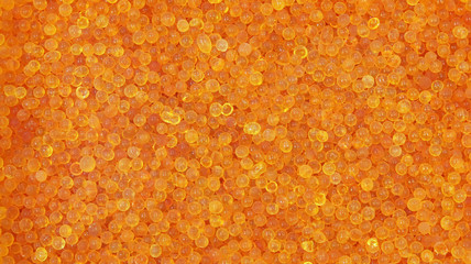 The crystal of orange silica gel in laboratory when expired turn color from orange to green range, use for remove water or moisture, eliminate dehydrate from compounds, background pattern or texture.