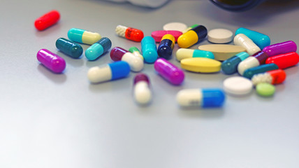 Colorful tablets, pills and capsules medicine using for treatment and cure the disease or sickness. Drug prescription using for medication in medical clinic, pharmacy Pharmaceutical service concept.