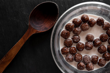 breakfast concept cereals balls milk dark black spoon