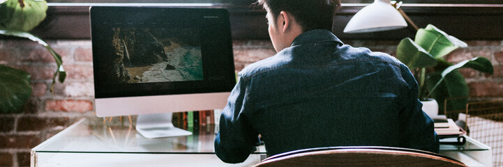 Photographer editing a photo at the desk