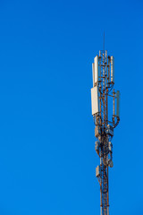 Mobile communications antenna against a blue sky