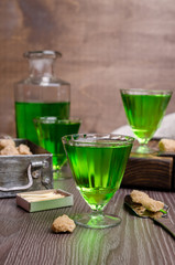 Fototapeta na wymiar Green liquid in a glass