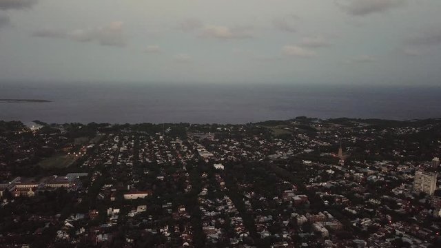 Suburb drone on a cludy day with houses, buildings an river in buenos aires
