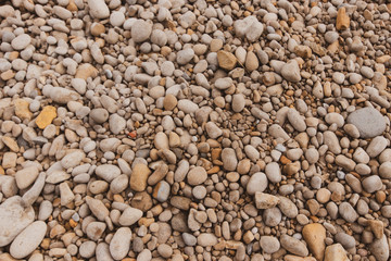 Sea stones background in a beach