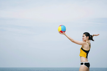 Woman playing beach volleyball