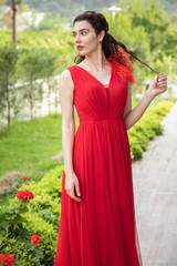 a young girl in red dress