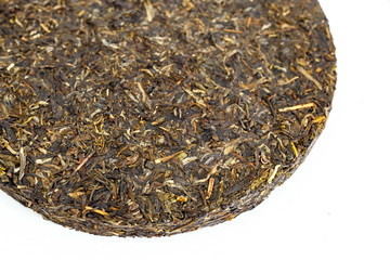 Puer tea in the form of tortillas on a white background, different varieties.