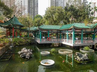 Garden of good wishes in the temple complex of Wong tai Sin. Pagodas with bridges in the Chinese...