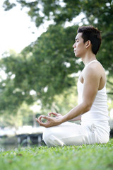 Man meditating in the park