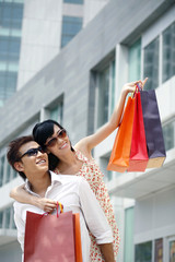 Man and woman with shopping bags