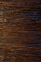 Texture of a brown tree. Natural surface of the working space. cracked and friable. macro photo. vertical shot.