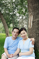 Fototapeta premium Senior man and woman smiling at the camera