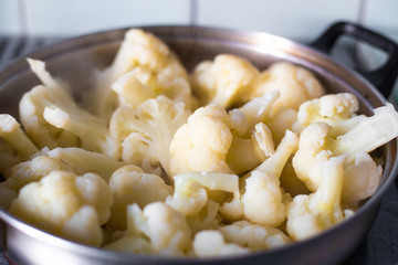 cauliflower inflorescences are cooked in a pan, tasty healthy vegetable food,