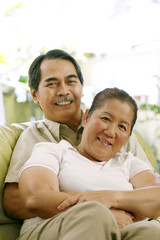 Senior man embracing senior woman