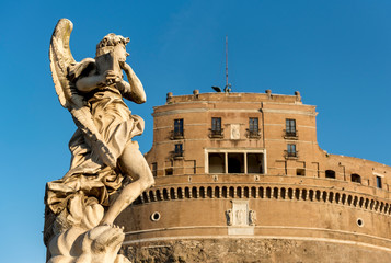 Fototapeta na wymiar Angel statue and Castel Sant'Angelo, Rome, Italy