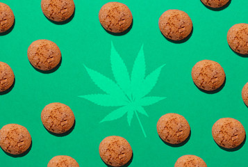 chip cookies with marijuana isolated on green background. pattern