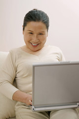 Senior woman using laptop