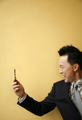 Businessman screaming into his mobile phone