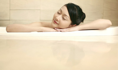 Woman relaxing in the bathtub