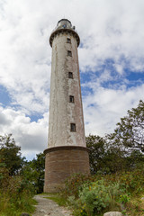 Fototapeta na wymiar An old white beacon, lighthouse, sightseeing