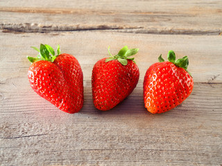 strawberries on wooden background