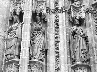Sculptures on the wall of The Cathedral of Saint Mary of the See. 
Seville, Spain. August 2012
Black and white