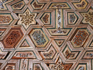Intricate wood pattern on the wall in the form of geometric shapes.
Sevilla, Spain. August 2012.
