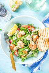 Healthy food concept, Diet salad plate. Fresh seafood salad recipe. Grilled shrimp prawns, fresh vegetable salad and egg.