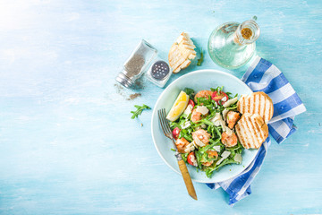 Healthy food concept, Diet salad plate. Fresh seafood salad recipe. Grilled shrimp prawns, fresh vegetable salad and egg.